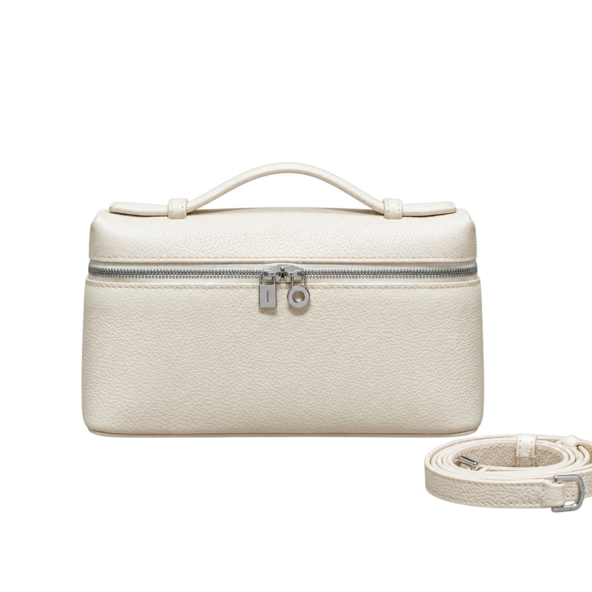 A Lucca classic grain cream leather handbag with a top handle, silver zipper, and lock, shown with a detachable crossbody shoulder strap, by Bella Dove
